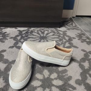 Beige rhinestone slip on sneaker.